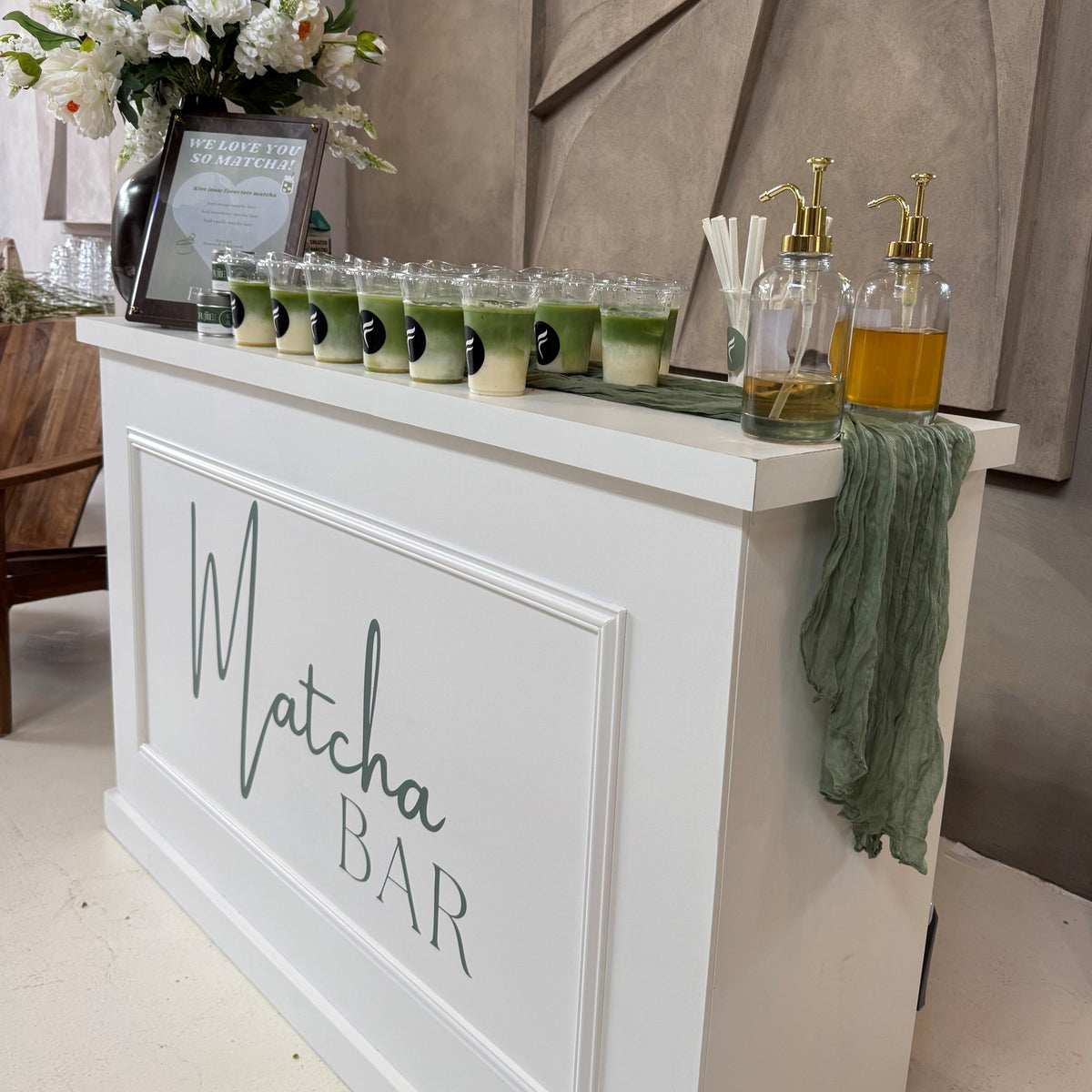 Mobile matcha bar with drinks and flowers